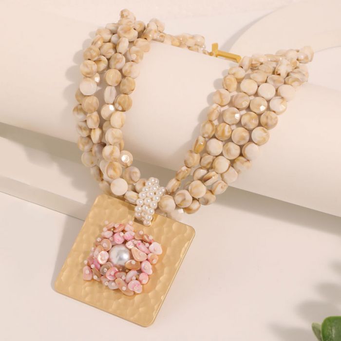 Shell Beaded Choker with Bold Gold Tone Medallion in Cream